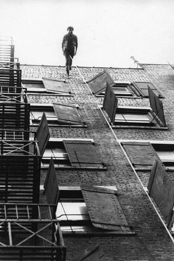 Poster of Man Walking Down the Side of a Building